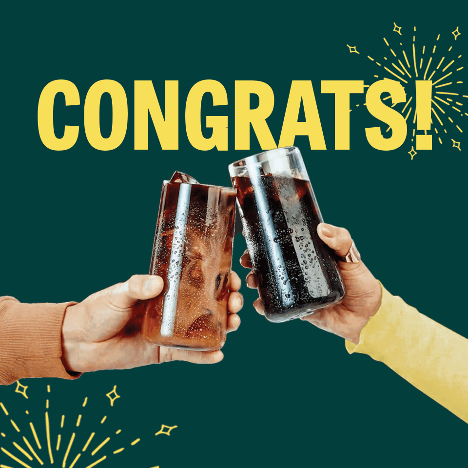 Front of Wandering Bear gift card showcasing CONGRATS! headline and two hands clinking coffee cups on green background