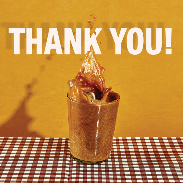 Front view of Wandering Bear gift card with orange background, large 'THANK YOU!' headline and illustrated iced coffee cup