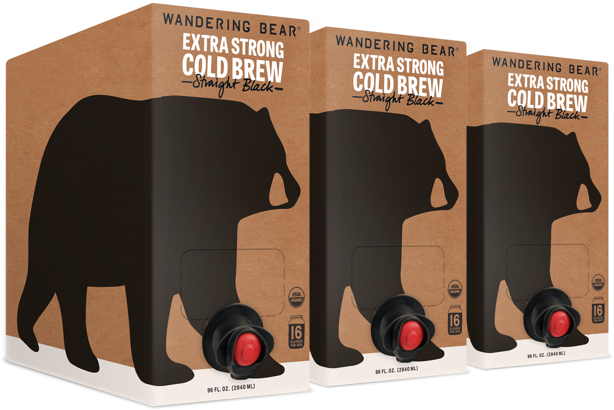 Three-quarter view of three 96 fl oz Wandering Bear Extra Strong Cold Brew boxes with front taps on white background